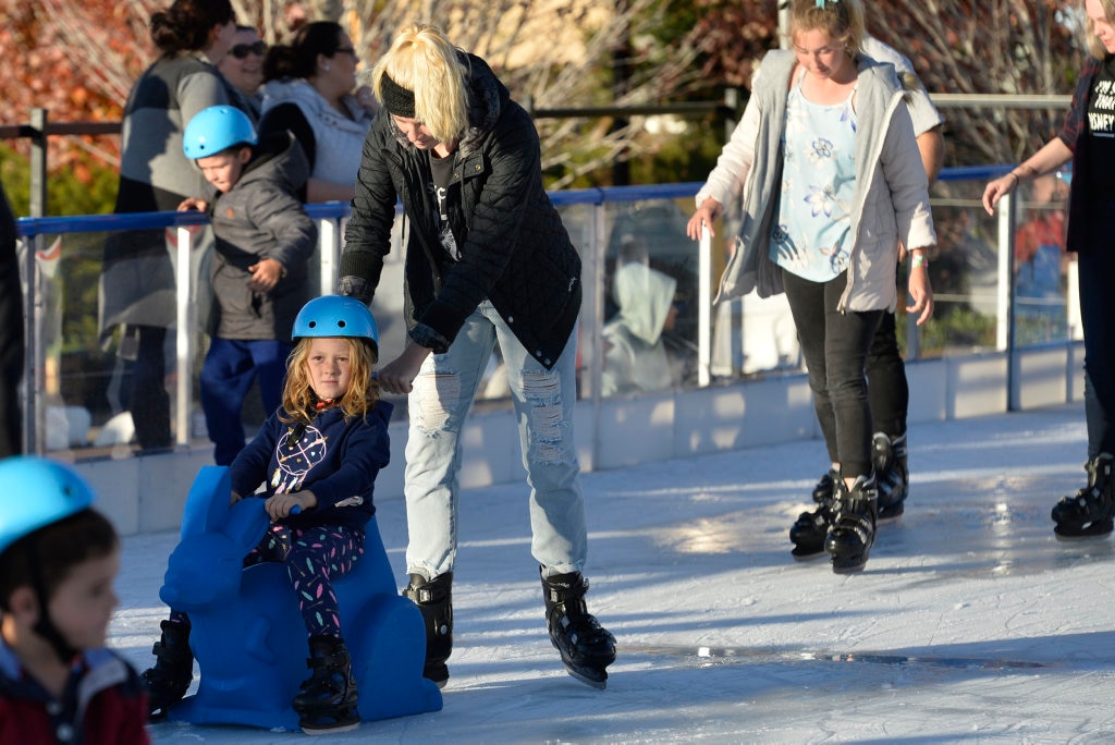 Elizabeth Bennett pushes her daughter Rylee during ice skating at Winter Wonderland in the Civic Square, Friday, June 22, 2018. Picture: Kevin Farmer