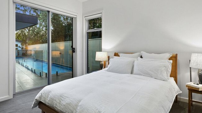 The main bedroom boasts direct pool access.