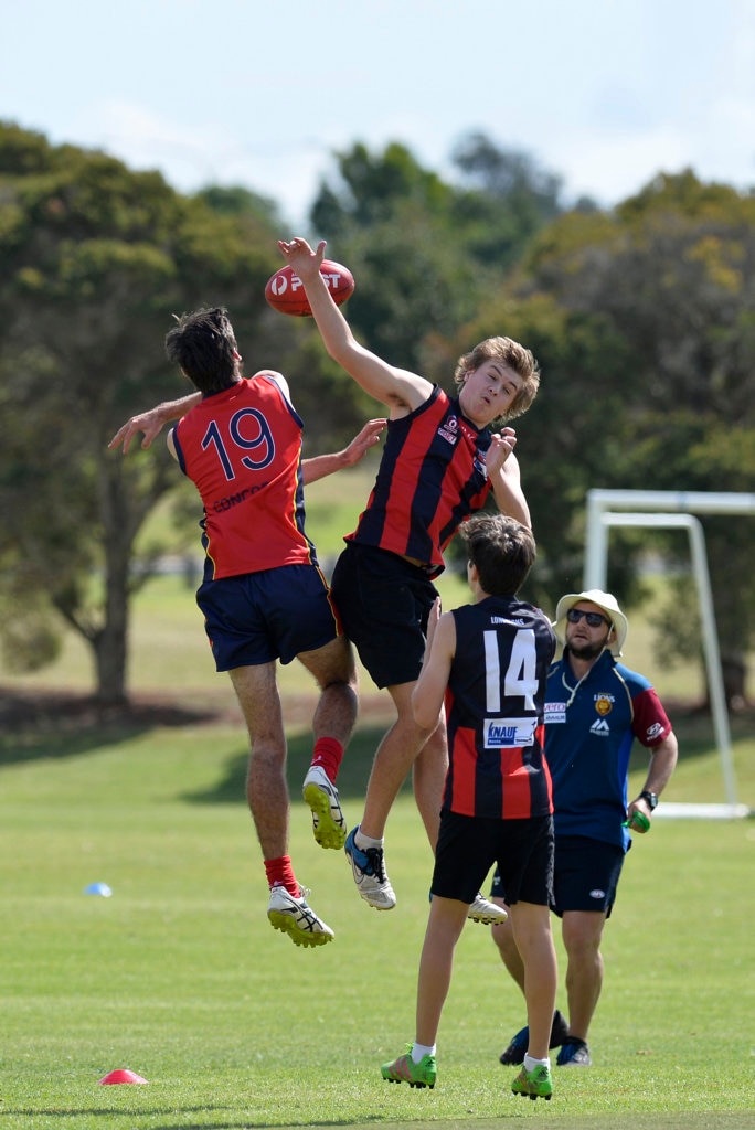 Matthew Christensen (left) of Concordia and Hayden Birkbeck of Laidley State High School in AFL Queensland Schools Cup Darling Downs round at Captain Cook ovals, Friday, April 27, 2018. Picture: Kevin Farmer