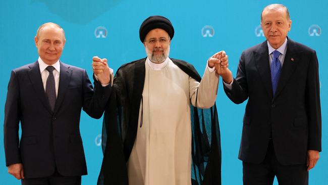 Vladimir Putin, Ebrahim Raisi and Recep Tayyip Erdogan in Tehran on Tuesday. Picture: AFP