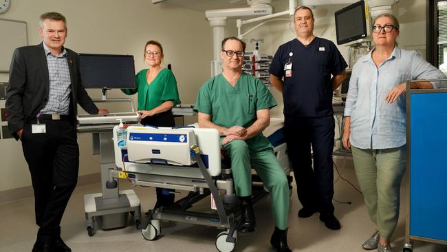 In a Royal Adelaide Covid intensive care unit is Dr Stewart Moodie, medical lead end of life; Louise McGuire, acting nurse lead critical care, perioperative, Dr David Evans, intensive care specialist, Andrew Barrett, clinical nurse in ICU and Mandy Kocher, ICU critical care nurse. Picture: Tricia Watkinson