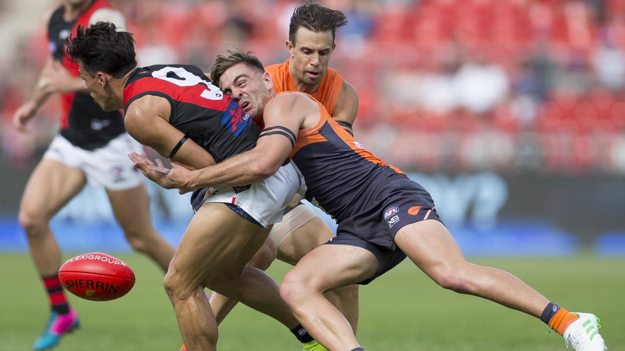 Stephen Coniglio tackles Dylan Shiel in the opening round of 2019.