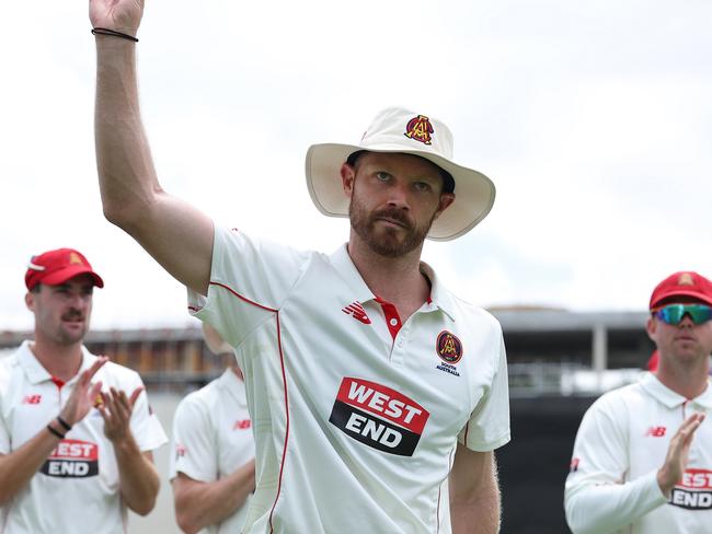 PERTH, AUSTRALIA - FEBRUARY 09: Nathan McAndrew of South Australia holds the ball aloft while walking from the field at the end Western Australia's second innings with the bowling figures of 7 wickets for 11 runs during the Sheffield Shield match between Western Australia and South Australia at the WACA Ground, on February 09, 2025, in Perth, Australia. (Photo by Paul Kane/Getty Images)