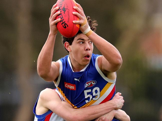 MELBOURNE, AUSTRALIA - SEPTEMBER 09: Cooper Trembath of the Eastern Ranges is tackled by Charlie Richardson of the Oakleigh Chargers  during the Coates Talent League Boys Quarter Final match between Eastern Ranges and Oakleigh Chargers at Highgate Reserve on September 09, 2023 in Melbourne, Australia. (Photo by Kelly Defina/AFL Photos/via Getty Images )