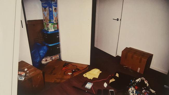 The bedroom and closet where the victim was detained, with jumper leads on the floor and a butane canister on the bed. Picture: SA Police