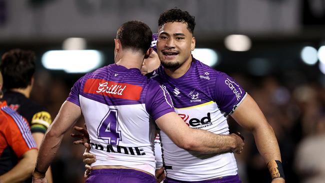 PENRITH, AUSTRALIA - AUGUST 15: Eliesa Katoa of the Panthers celebrates with team mate Nick Meaney after scoring a try during the round 24 NRL match between Penrith Panthers and Melbourne Storm at BlueBet Stadium, on August 15, 2024, in Penrith, Australia. (Photo by Brendon Thorne/Getty Images)