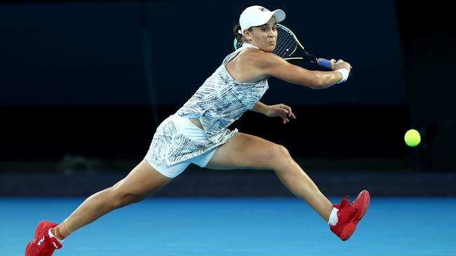 Ash Barty leaps into a backhand against Jessica Pegula on Tuesday night