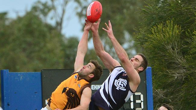 RDFL football: Melton Centrals V Woodend-Hesket. Melton's Pete Corridig flies from behind.