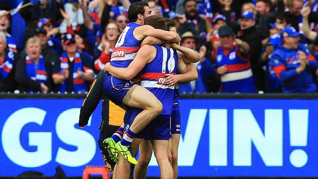 Bulldogs players celebrate winning the 2016 premiership. Picture: Toby Zerna