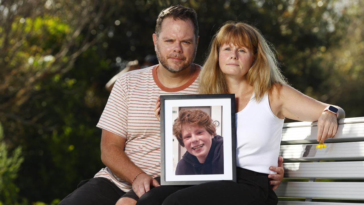 Andrew and Diana Gill sit on a memorial bench for their late son Josh at North Curl Curl Beach. Picture: Richard Dobson