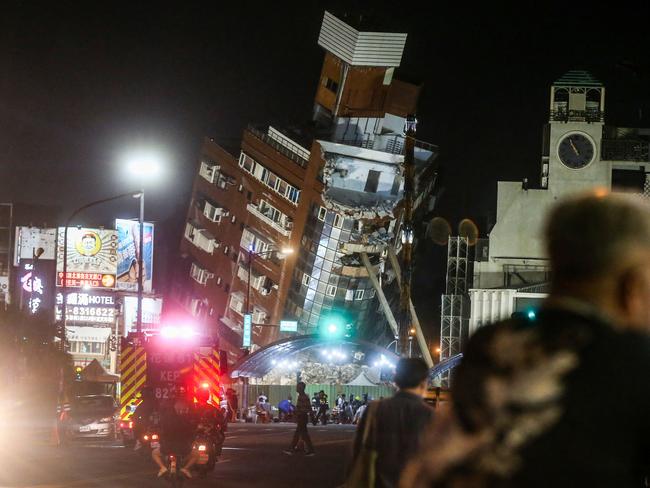 A building severely damaged by an earthquake in Japan is demolished. Picture: AFP