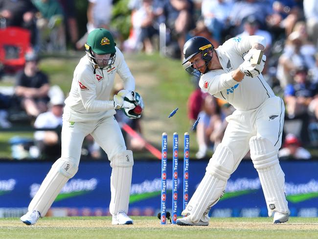 Nathan Lyon knocks over the off-stump of New Zealand's Glenn Phillips. Picture; AFP