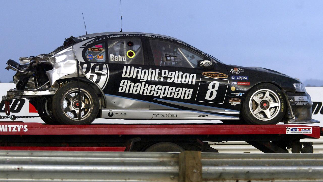Craig Baird’s destroyed Falcon is taken from the track after his horror crash in 2005.