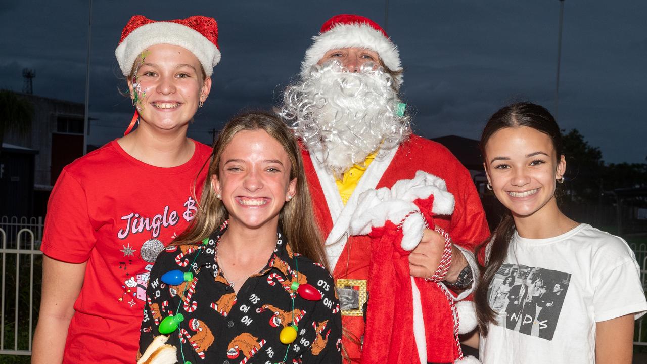 Ainslee Richardson, Santa, Emma Keune and Zoe McCarthy at Christmas Carols Hosted by Sarina Surf Lifesaving Club Saturday 21 December 2024 Picture:Michaela Harlow