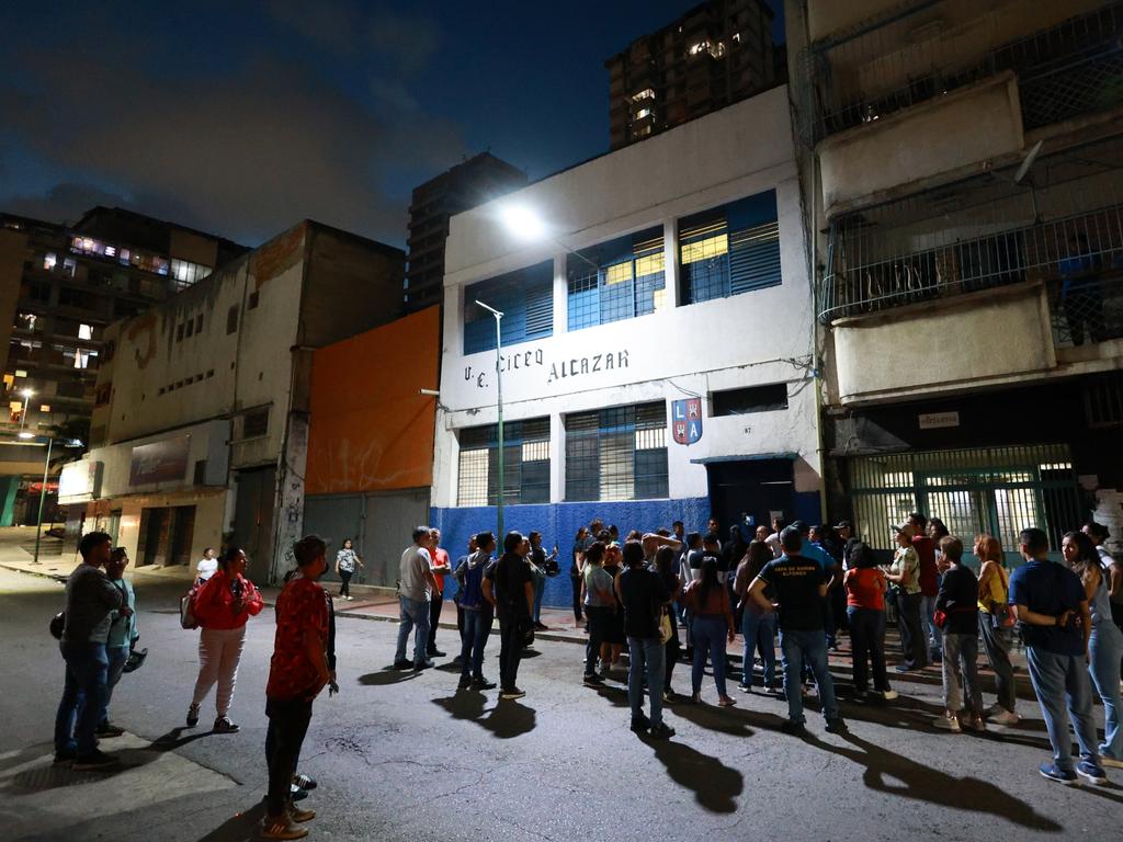 At a polling station near AFP’s offices in Caracas, a group of people gathered after closing time, shouting: ‘We want to count!’ outside a shuttered door.