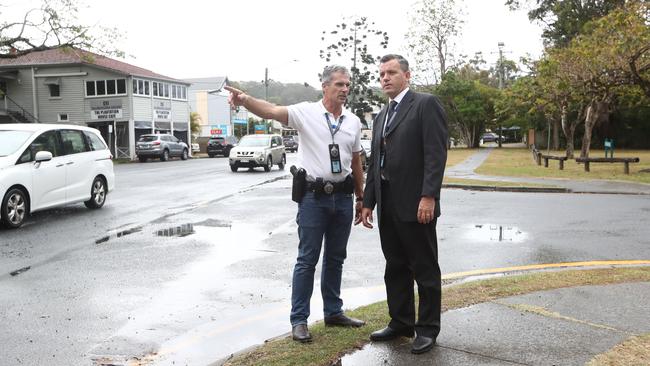 Detectives Christopher Tritton and Rodney Seaman near where Mr Ross was found dead. Picture: Jason O'Brien.