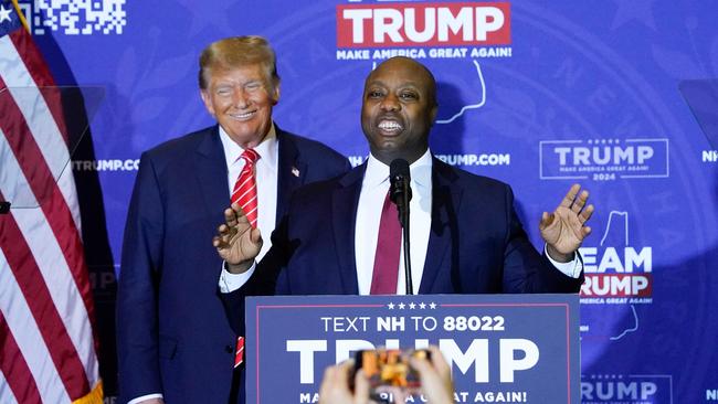 US Republican senator from South Carolina Tim Scott speaks as Republican presidential hopeful Donald Trump listens during a campaign event in Concord, New Hampshire. Picture: AFP