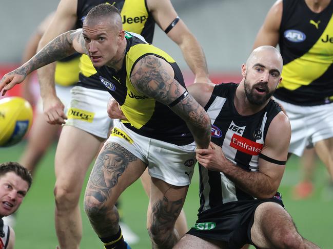 AFL Round 2. Collingwood v Richmond at the MCG. 11/06/2020.  Dustin Martin of the Tigers tackled by Steele Sidebottom of the Magpies    . Pic: Michael Klein