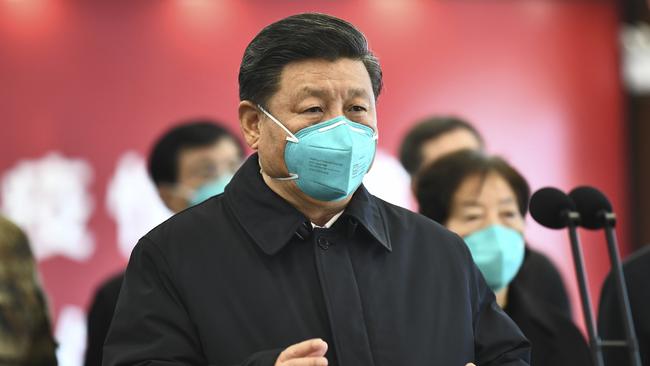 Chinese President Xi Jinping talks by video with patients and medical workers at a hospital in Wuhan in March. China and Russia are likely to try to stymie the push for a WHO probe. Picture: Xie Huanchi/Xinhua via AP