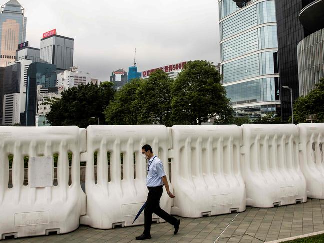 A man walks past barricades in Hong Kong. Picture: AFP