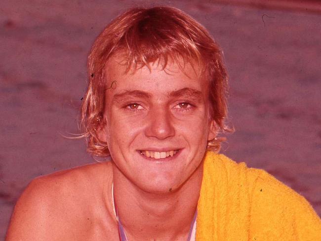 News/sport 15/11/1973 Australian Swimmer Steve Holland in Brisbane..Stephen Roy Holland OAM (born 31 May 1958) is an Australian former freestyle swimmer of the 1970s who won a bronze medal in the 1500 m freestyle at the 1976 Summer Olympics in Montreal. In a brief and spectacular career, he broke 12 world records and was known as the Super Fish after his coach Laurie Lawrence likened his two-beat kick to the tail of a fish.Holland made his first headlines as a 15 year old, when he broke the 1500 m freestyle world record at the Australian Championships. In the process, his 800 m split also broke the 800 m freestyle world record. This qualified him to make his international debut at the 1973 World Aquatics Championships in Belgrade, Yugoslavia, where he again broke both world records en route to the 1500 m freestyle gold medal, setting a time of 15 m 31.85s. He was awarded the ABC Sportsman of the Year award.In 1974, Holland won a gold medal in the 1500 m freestyle at the Christchurch Commonwealth Games, leaving the silver medallist from New Zealand, Mark Treffers more than 25 seconds in arrears. Although the time was not a world record, his 800 m split of 8 m 15.88s bettered his previous 800 m record.On arrival in Montreal for the 1976 Summer Olympics, Holland had set 12 world records, and was expected by the Australian public to win. However, he departed from his usual strategy of fast-starting, attacking swimming and decided to swim conservatively and outstay his main rivals, the United States duo of Bobby Hackett and Brian Goodell. Holland made his move at the 800 m mark, but then found that he was fading in the final 200 m, when Goodell and Hackett overtook him. Although Holland had bettered his previous world record, Goodell surpassed it to take the gold.Holland later swam the 400 m, finishing fifth behind Goodell, who again set a world record. After the Games, weighed down by the burden of public disappointment, Holland decided at the age of 18 that he was "washed up" and decided to retire from competitive swimming.On 10 June 1985, Holland was awarded the Order of Australia Medal for services to sport of swimming.[1] On 23 June 2000, Holland was awarded the Australian Sports Medal.[2]Neg no CT-R-13311.Picture by Ted Holliday.The Courier-Mail Photo Archive.Scanned July 2011