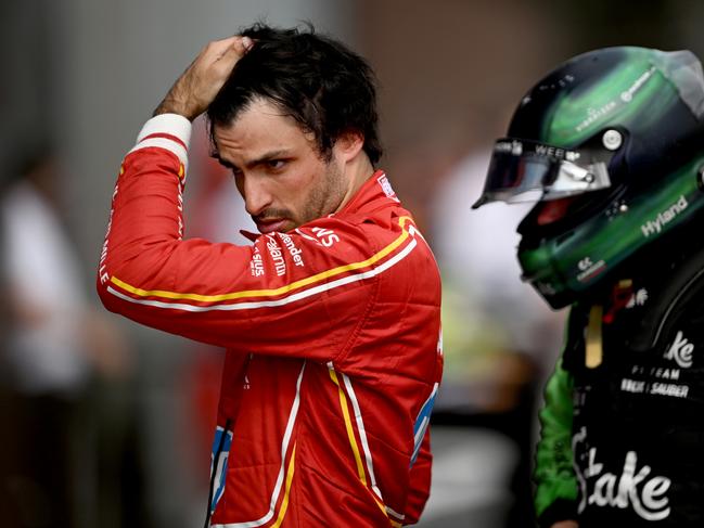 IMOLA, ITALY - MAY 19: Carlos Sainz of Spain driving (55) the Ferrari SF-24 reacts in parc ferme following the F1 Grand Prix of Emilia-Romagna at Autodromo Enzo e Dino Ferrari Circuit on May 19, 2024 in Imola, Italy. (Photo by Rudy Carezzevoli/Getty Images)