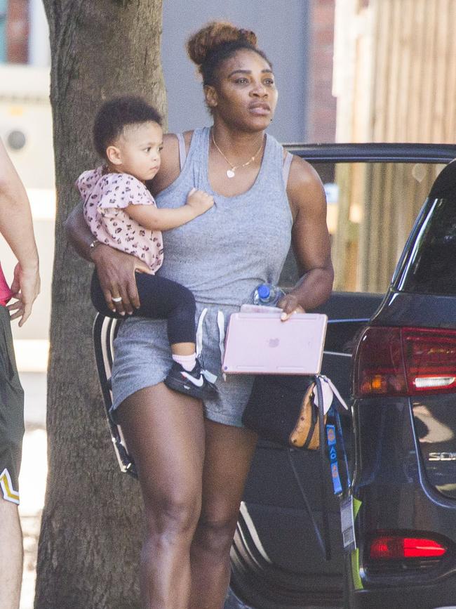 Serena Williams and her husband Alexis Ohanian enjoy an afternoon walk with their 1-year-old daughter Alexia Olympia. Serena's daughter looked seriously cute, toddling her way down the footpath, wearing Nike sneakers like her Mummy. Picture: MediaMode