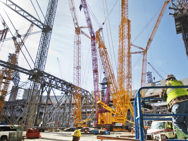 FILE - In this May 16, 2016, file photo, cranes sit inside the Atlanta Falcons new NFL football stadium currently under construction in Atlanta. The NFL awarded Super Bowls to Atlanta (2019), Miami (2020) and Los Angeles (2021), three cities that made significant financial investments in new stadiums or recently upgraded an existing one, Tuesday, May 24, 2016, at the NFL owners meetings. . (AP Photo/David Goldman, File)