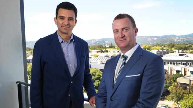 Buildtec managing director Anthony Carrocci and 1834 Hotels chief executive Andrew Bullock on the balcony of a new serviced apartment in Kent Town. Picture: Michael Marschall