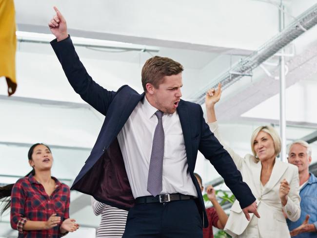 Cropped shot of an office party with people dancing and having a good time; Tax business generic