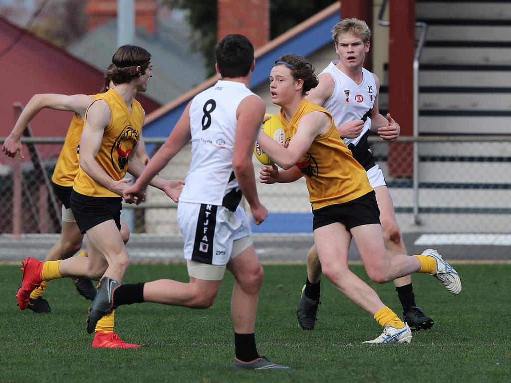 Under 16 Boys STJFL vs. NTJFA match, North Hobart Oval: South's Ned Ward running through heavy congestion. Picture: LUKE BOWDEN