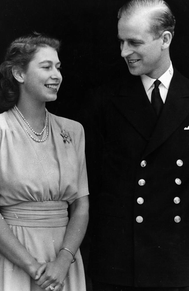 Then Princess Elizabeth and Philip Mountbatten, Duke of Edinburgh, in their official engagement photos in 1947. She wore a string of pearls and the same brooch in the recent video call. Picture: Fox Photos/Getty Images