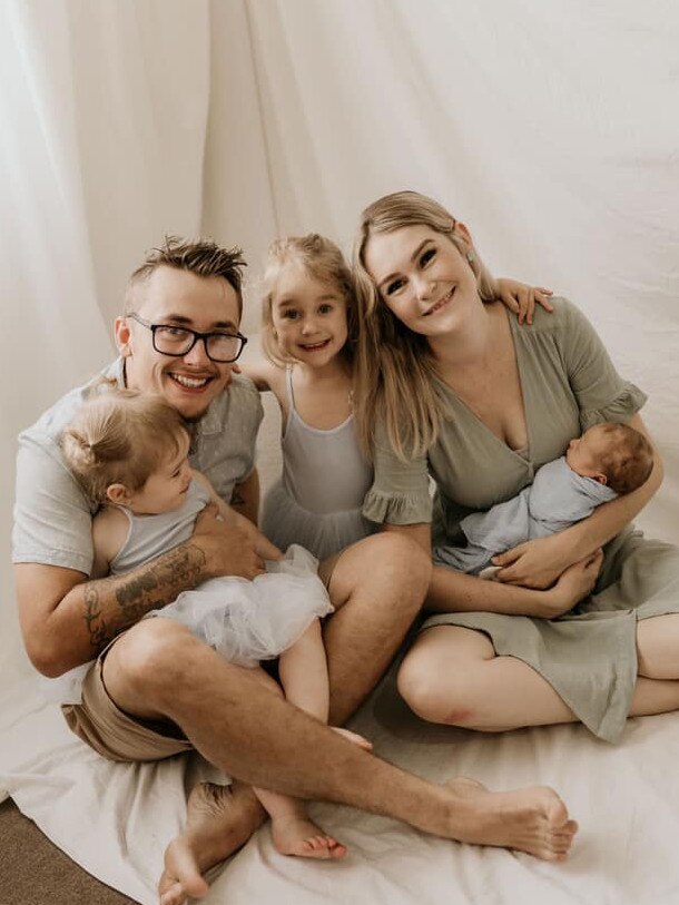 Brendan Tyrrell and his wife Aliesha with their young children.