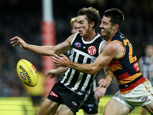 Connor Rozee and Alex Neal-Bullen grapple. Picture: Mark Brake/Getty Images.