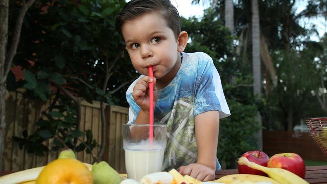 Pictured eating a healthy breakfast of fruit and milk is Zack Gomes 3, at home in Cromer today. Picture: Tim Hunter.
