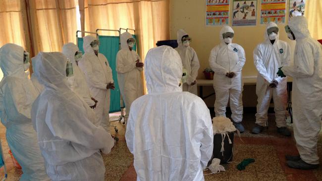 Health workers at Georgetown University Medical Center are trained how to properly use protective gear to protect against the Ebola virus in the US. (AP Photo/Dan Lucey)