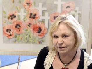 COLOUR OF SUFFERING: Grafton artist Lyn Butchart with her watercolour painting, Flanders Fields, at the South Grafton District Ex-Servicemens Club.