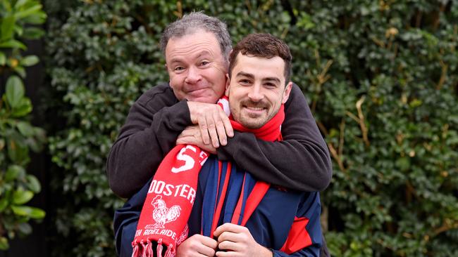 Norwood midfielder Will Abbott with his father and Roosters supporter Martin before the 2018 SANFL grand final. Picture: Naomi Jellicoe