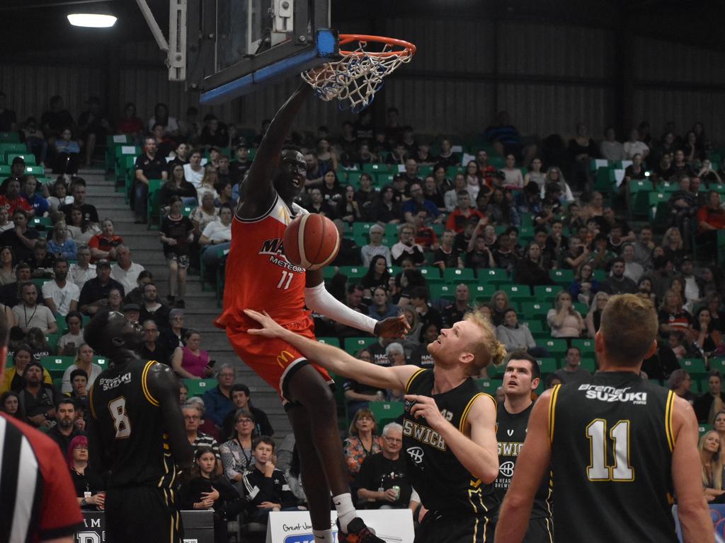 Emmanuel Malou throws down a dunk for Mackay Meteors against Ipswich Force in the NBL1 North match, July 24 2021. Picture: Matthew Forrest