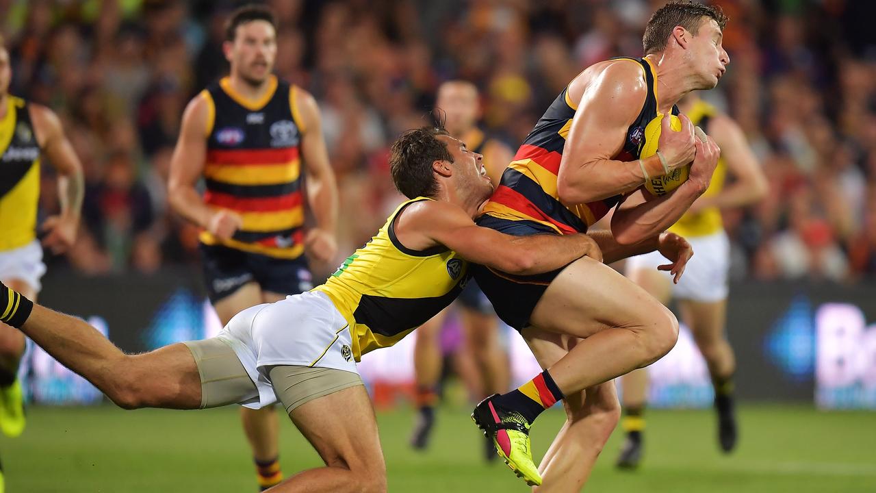 <a capiid="ddd921fe8ffe8d209c35b3e0ada4316c" class="capi-video">'Confuse Rance', beat Tigers</a>
                     Adelaide forward Josh Jenkins leads Richmond star Alex Rance to the ball.