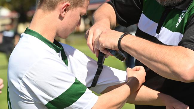 Ingle Farm Soccer Club members wore black armbands at its games on Sunday including Division C-grade match. Picture: Keryn Stevens