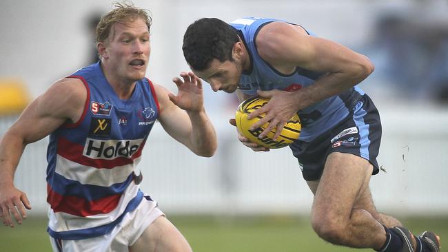 Sturt's Matt Crocker bounds away from Central's Travis Schiller. Picture: AAP Image/Dean Martin