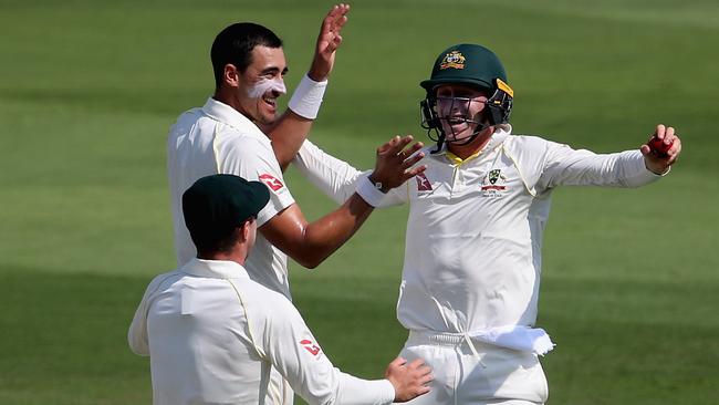 Mitchell Starc and Marnus Labuschagne celebrates the wicket of Mohammad Hafeez. Picture: Getty