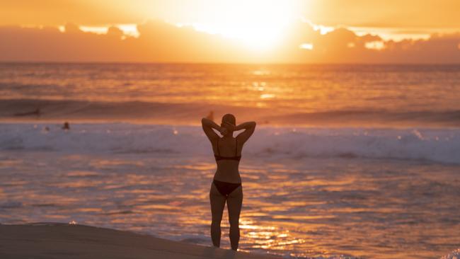 Swimmers and surfers return to Maroubra beach on Monday morning. Picture: Getty Images