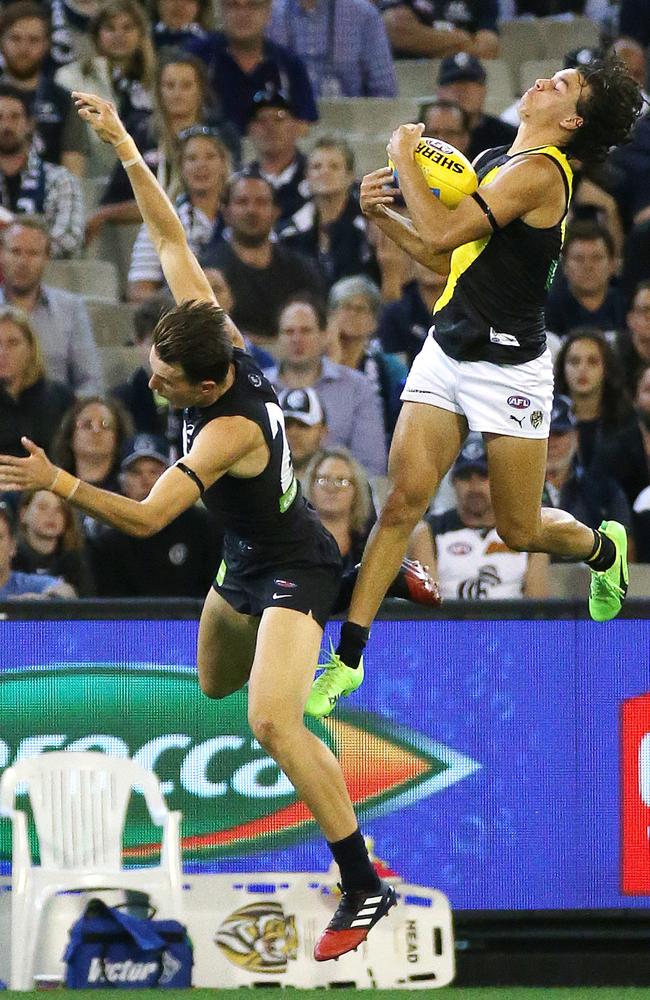 Daniel Rioli flies for a spectacular mark. Picture: George Salpigtidis