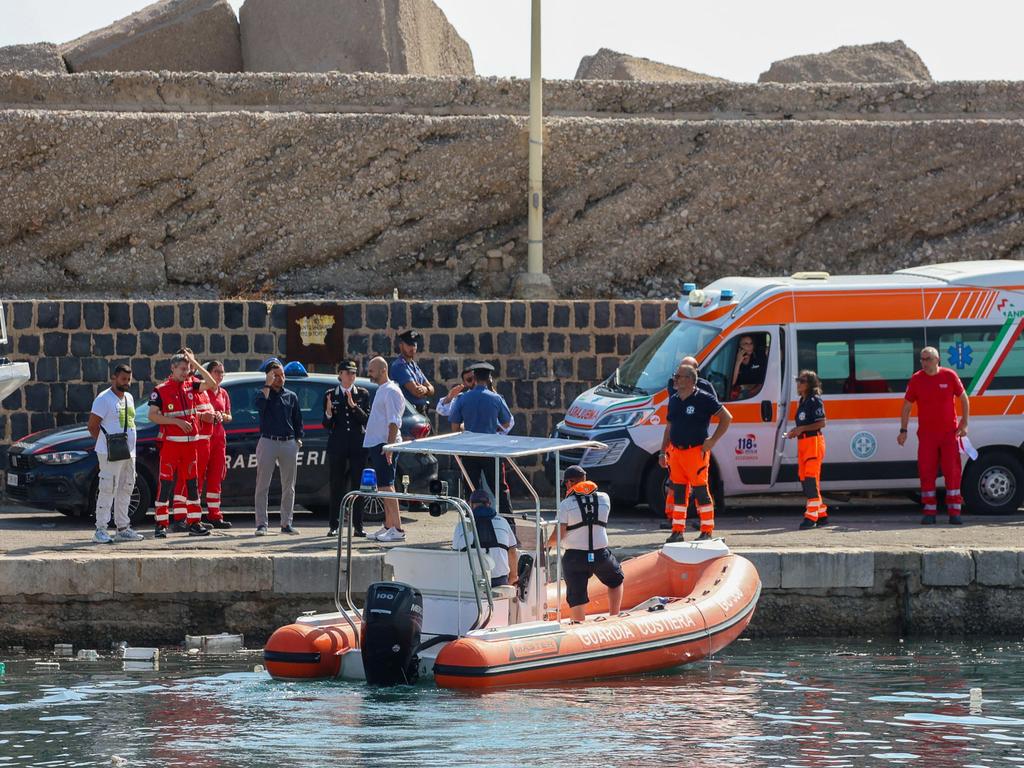 Police and Coast Guard workers prepare to search the site. Picture: AFP