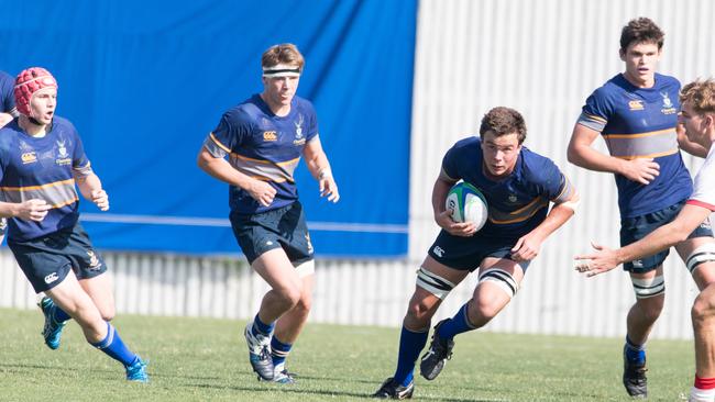 Greg Stoddart with excellent body height carrying the ball.