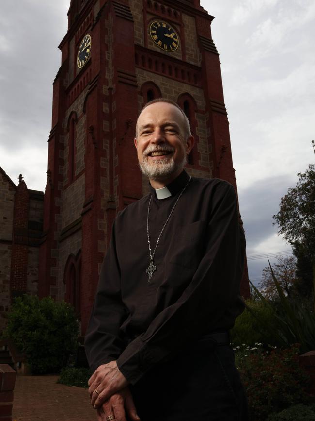Rev Sam Goodes in front of the bell tower at St Andrew's Church Walkerville. Picture: Emma Brasier