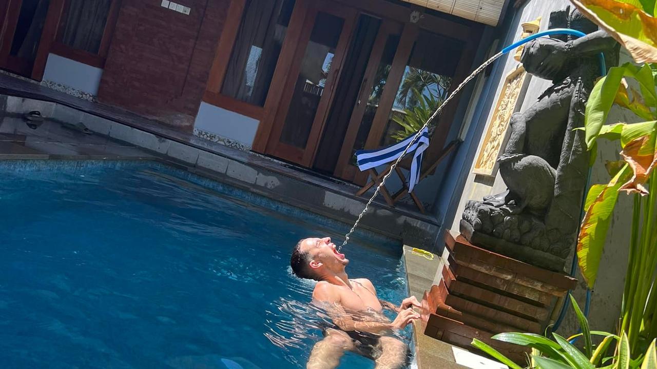 Isaac Power posted a photo of himself drinking from a hose in a Bali pool. Picture: Facebook