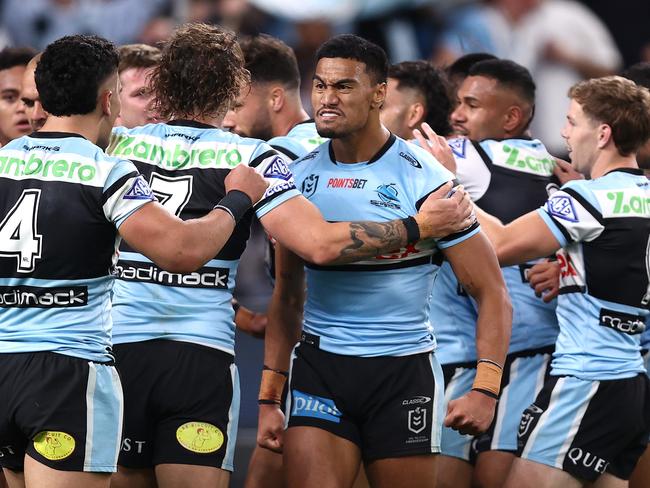 SYDNEY, AUSTRALIA - SEPTEMBER 20:  Ronaldo Mulitalo of the Sharks celebrates a try scored by Cameron McInnes during the NRL Semi Final match between Cronulla Sharks and North Queensland Cowboys at Allianz Stadium on September 20, 2024 in Sydney, Australia. (Photo by Jason McCawley/Getty Images)